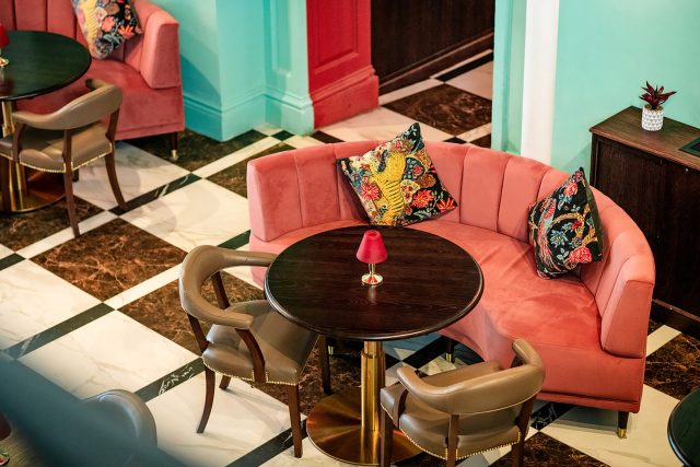An elegant alfresco dining arrangement at Essence by Atul Kochhar, set against the historic Grade II listed Pantiles during the summer music festival in Kent.