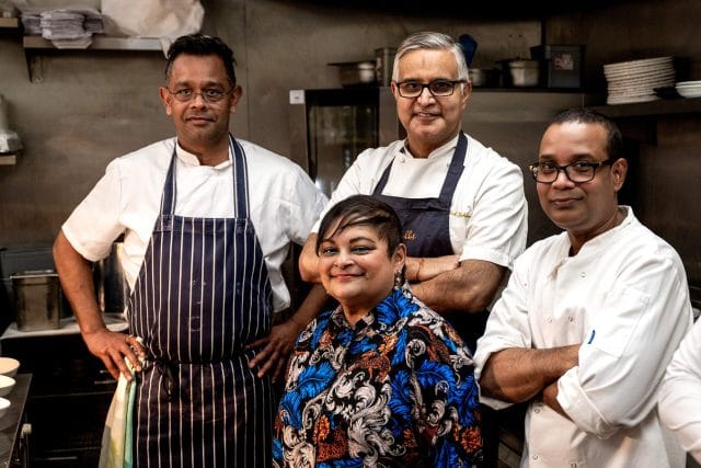 Michelin-starred Chef Atul Kochhar expertly preparing a dish during an exclusive pan-Indian wine dinner event at Essence in Tunbridge Wells.