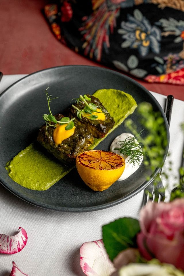 Chef Atul Kochhar's signature Clay Oven Cooked Lamb Shank, part of the exclusive Easter dining menu at Essence at The Pantiles.