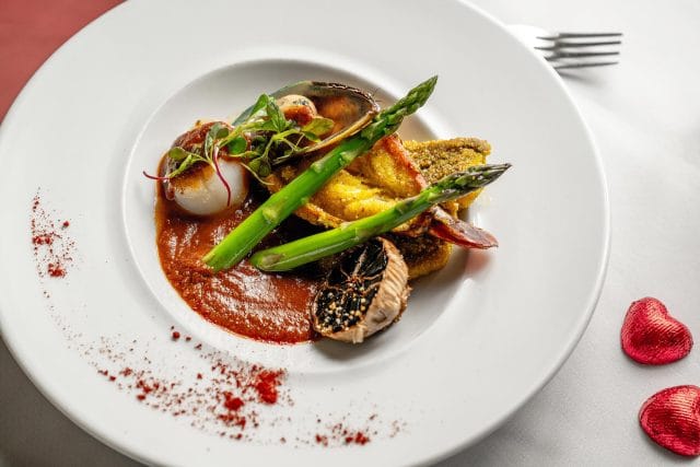 An elegant pan-Indian fine dining setting at Essence by Atul Kochhar, prepared for an exclusive Mother's Day celebration in Tunbridge Wells.