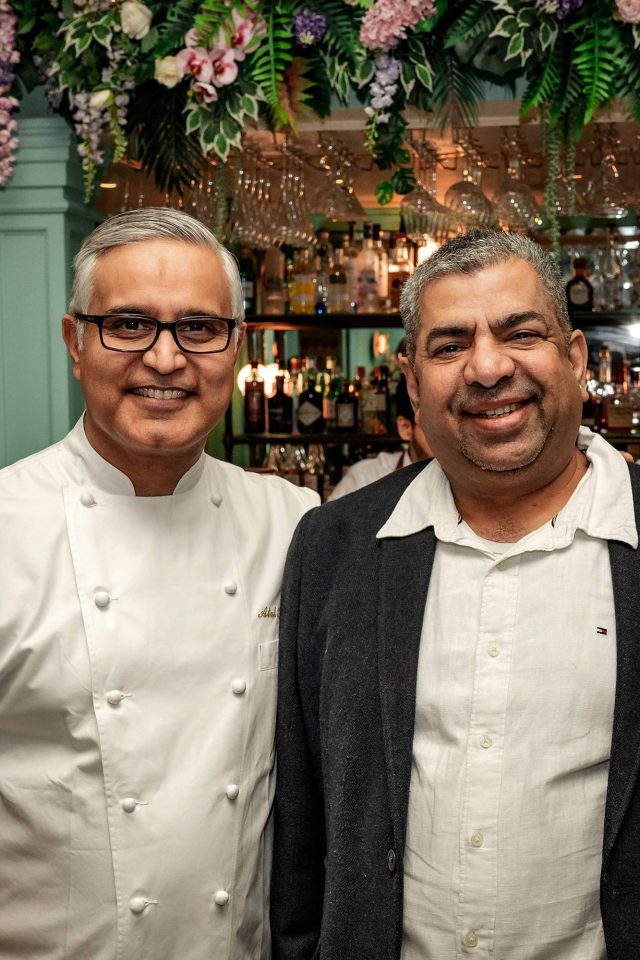 A lively party crowd enjoying custom cocktails and premium pan-Indian cuisine during the anniversary celebration at Essence in Tunbridge Wells.