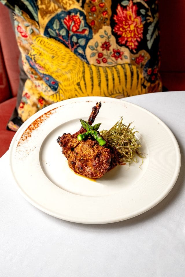 Michelin-starred Chef Atul Kochhar presenting an exquisite South Indian tasting menu dish at his pan-Indian restaurant in Kent.