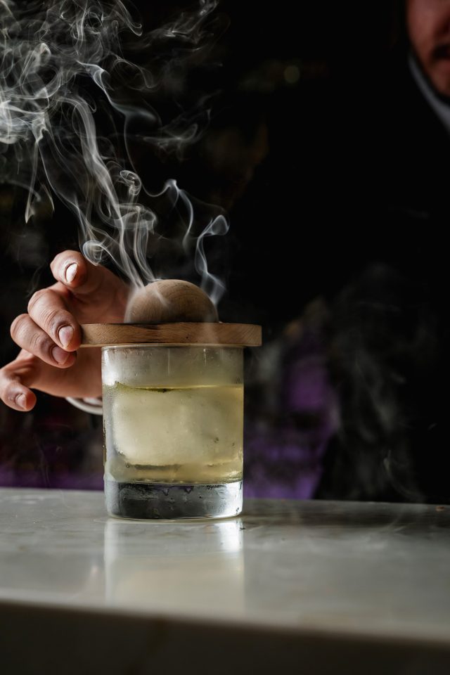 Theatrical smoked cocktail revealed on the bar at Essence restaurant in Kent.